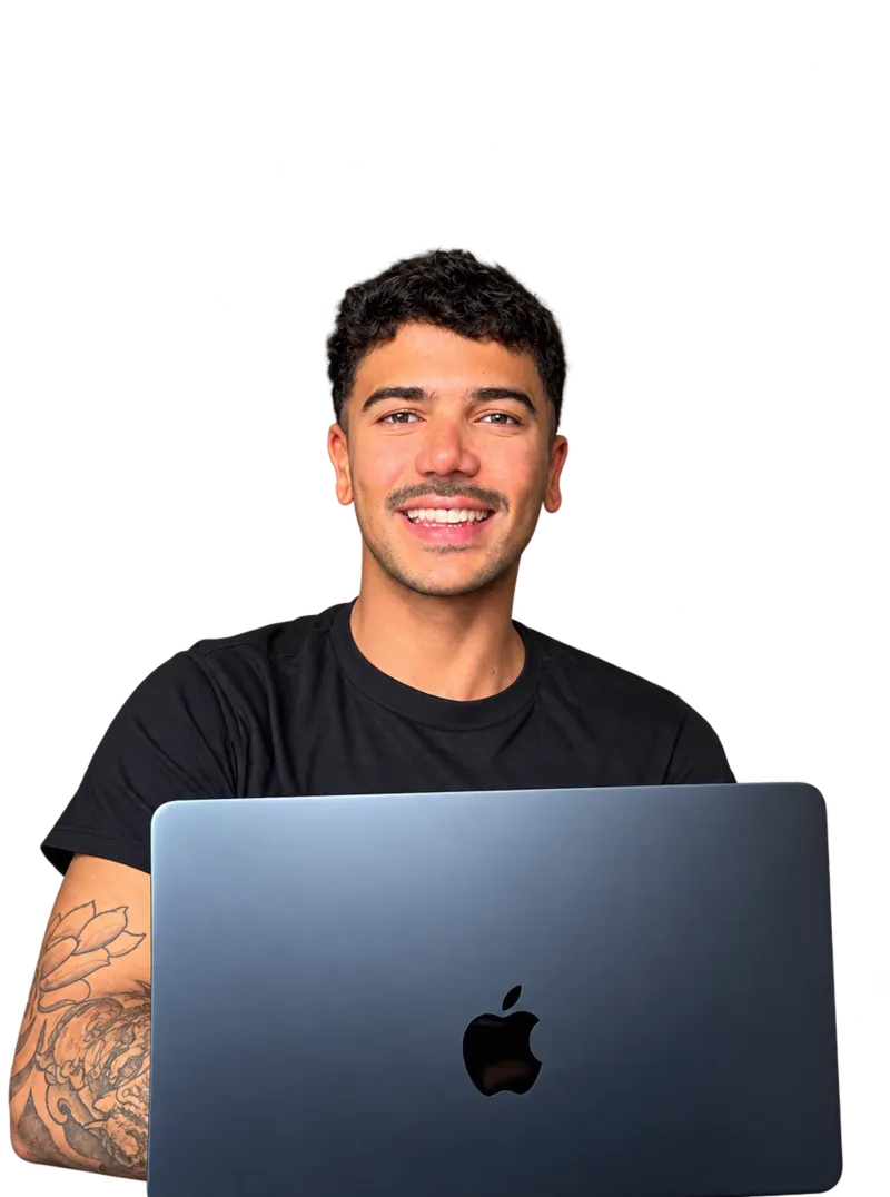 Lucas Lima, Sunshine Coast Google Ads Freelancer, smiling with his laptop
